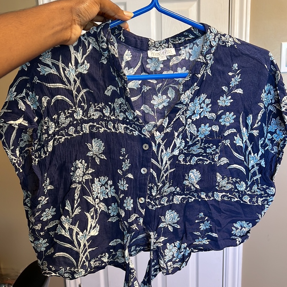 Patrons of peace navy blue flower shirt.